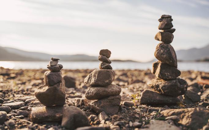 Tower of balancing rocks on beach